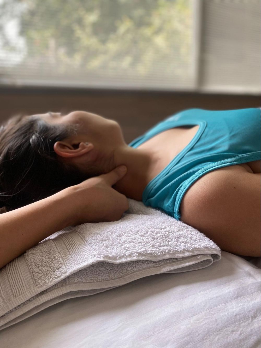 Therapist performing gentle neck manual therapy treatment to relieve pain and improve mobility - VARDĀN